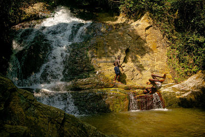 Water flowing through rocks in forest