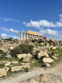 View of old ruin building against cloudy sky