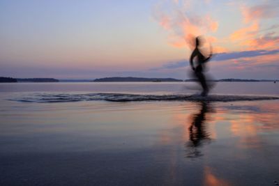 Silhouette of man standing on beach