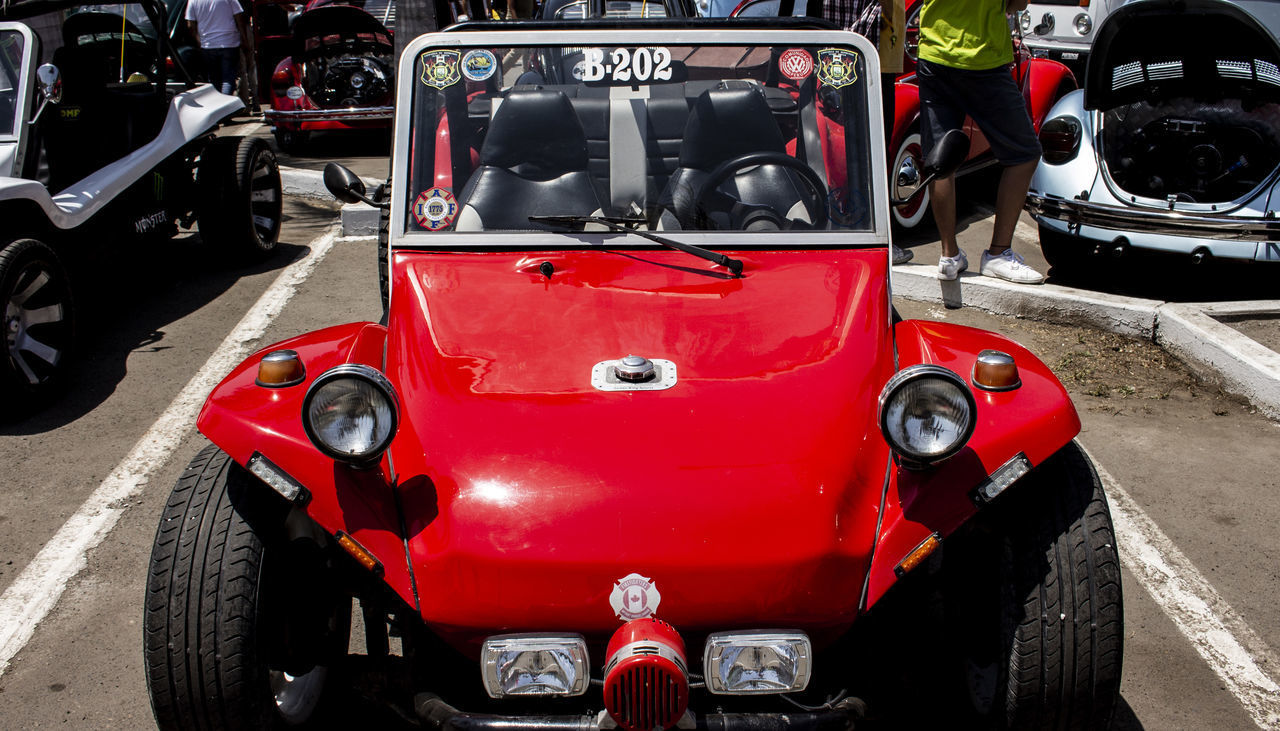 CLOSE-UP OF RED TRUCK IN CITY