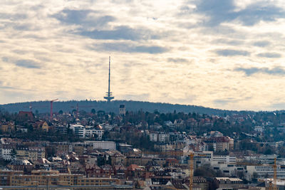 Stuttgart germany cityscape with tall antenna tower in the background. cloudy day.