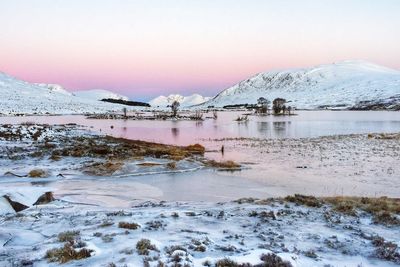 Scenic view of snow covered mountains