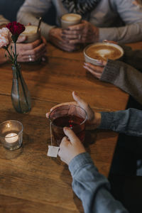 Hands holding cup with tea