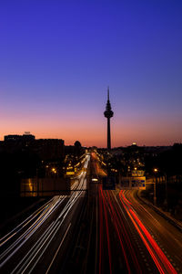 High angle view of light trails on road at night