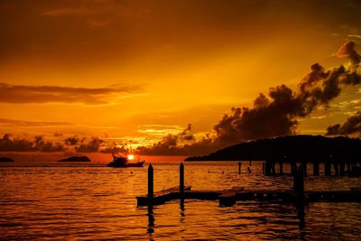 Scenic view of sea against orange sky