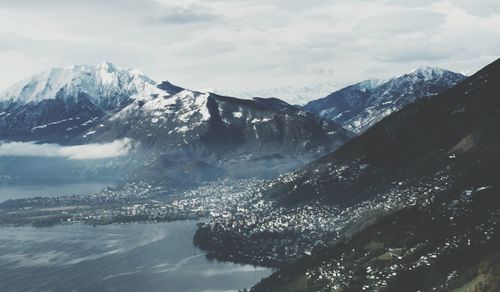 Scenic view of lake against cloudy sky