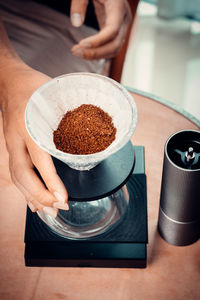 Midsection of person holding coffee