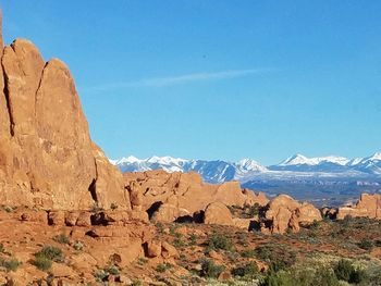 Scenic view of mountains against clear blue sky