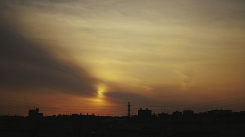 Silhouette of city at sunset