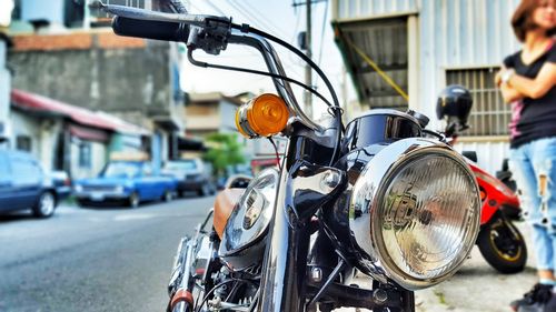 Close-up of person riding bicycle on road