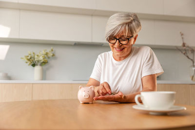 Portrait of senior man sitting at home