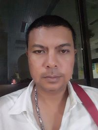 Close-up portrait of young man at home