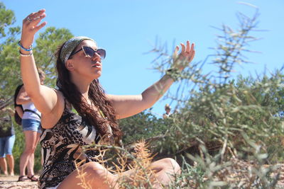 Summer meditation of a caucasian girl between the wild and dry nature in ibiza