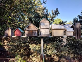 Birdhouses against trees