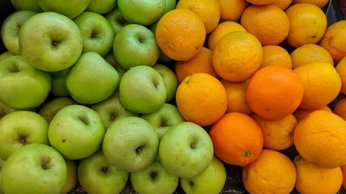 Full frame shot of oranges and apples