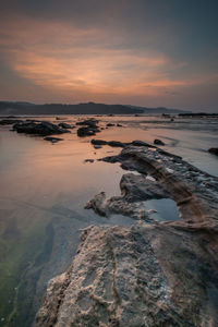 Scenic view of sea against sky during sunset