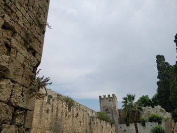 Low angle view of fort against sky