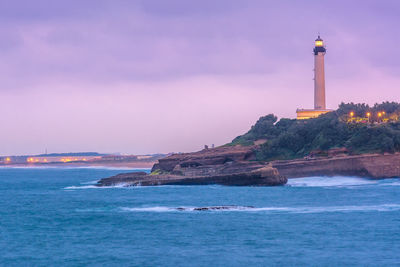 Scenic view of lighthouse in biarritz after sunset on a stormy weather
