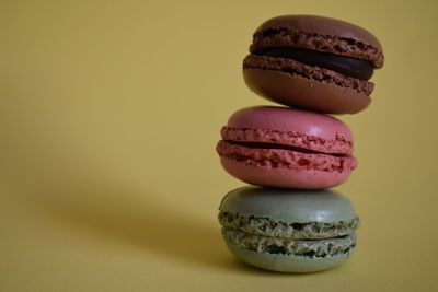 Close-up of multi colored candies against gray background