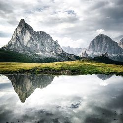 Reflection of mountains in lake against sky