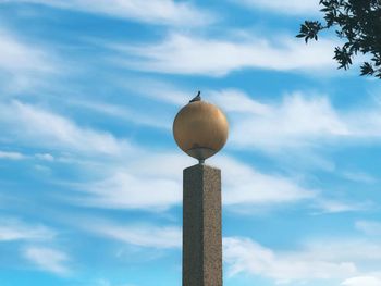 Low angle view of balloons against sky
