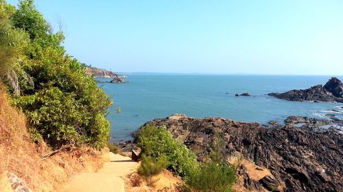 Scenic view of sea against clear blue sky