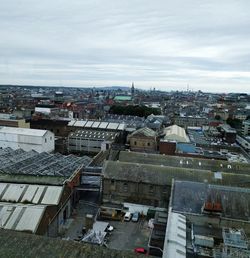 High angle view of buildings in city against sky