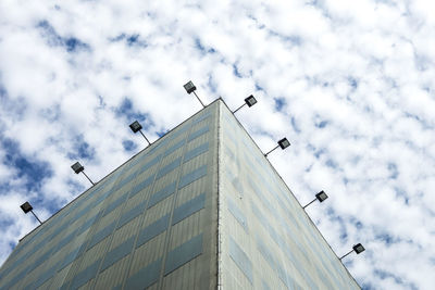 Low angle view of birds flying against sky