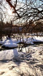 Scenic view of frozen lake against sky during winter