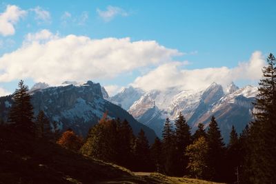 Scenic view of snowcapped mountains against sky