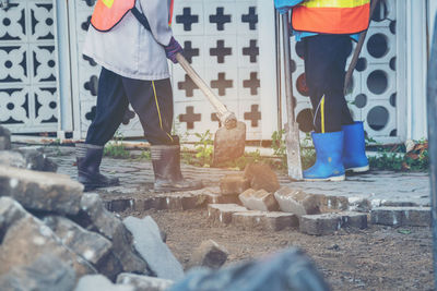 Low section of construction worker working at site