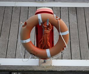 High angle view of inflatable ring and rope on pier