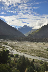 Morning view of mountains covered with clouds from the peak with bhaga river in darcha