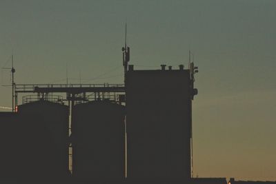 Silhouette of building against clear sky