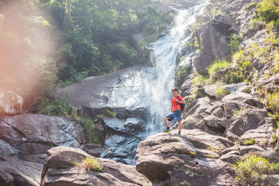 Scenic view of waterfall and rocks