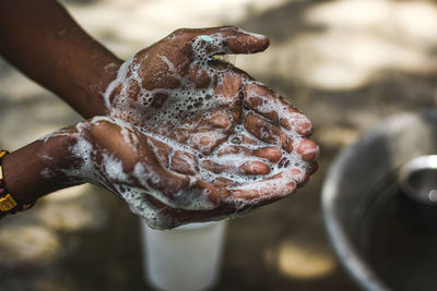 Close-up of hand holding ice cream