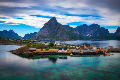 Scenic view of lake and mountains against sky