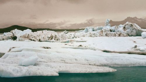 Scenic view of frozen sea against sky