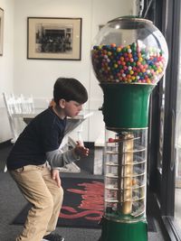 Boy standing on table