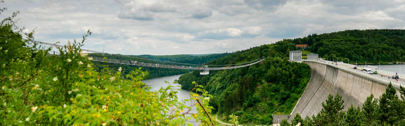 Panoramic view of bridge over river against sky