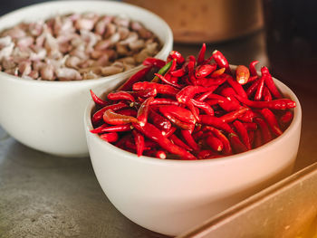 Close-up of red chili peppers in bowl on table