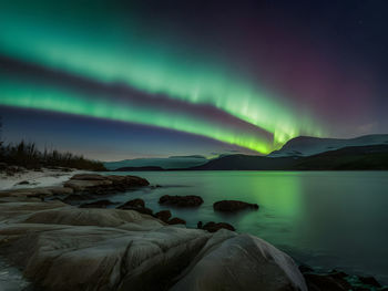 Scenic view of sea against sky at night