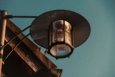 Low angle view of street light against sky