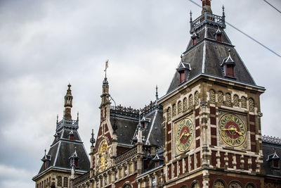 Low angle view of amsterdam central station against sky