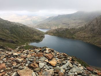 Scenic view of lake and mountains against sky