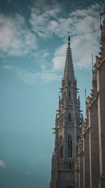 Low angle view of parliament building tower against sky