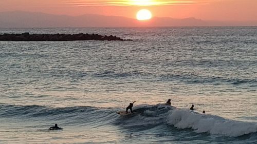 Scenic view of sea against sky during sunset