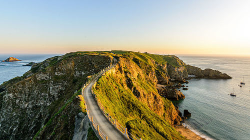 Scenic view of sea against clear sky during sunset