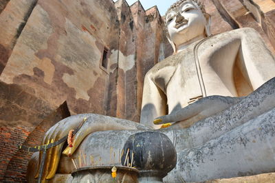 Low angle view of buddha statue