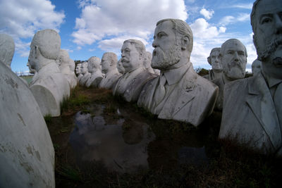 View of statues against cloudy sky